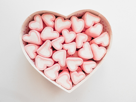 Pink marshmallow in a gift box in form of heart on white background, Many hearts marshmallows for present, Sweets in the form of hearts of marshmallow. Valentines Day Giftの写真素材