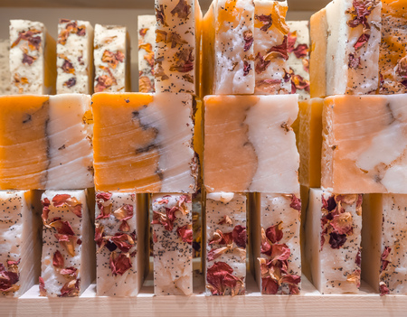 Bars of soap on a shop window. Ylang-ylang soap with natural cedar oil and herbal ingredients....