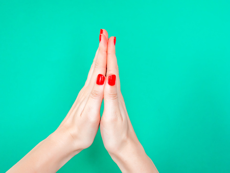 The Thank You Praying Hands Hand Sign. Say thank you with your hands by mimicking the praying hands emoji. Woman hold hands together is symbol prayer and gratitude on isolated turquoise green color background.の写真素材