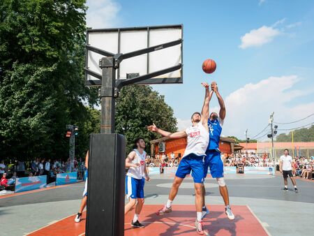 Moscow, Russia - August 4, 2018: Team playing basketball in the Gorky Park in summer. City street youth basketball tournament. Basketball player throws the ball into the basketball hoopのeditorial素材