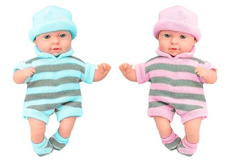 Two baby doll girl and boy in knitted dress on isolated white backgroundの写真素材