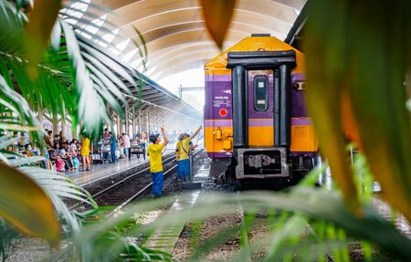 Bangkok, Thailand - May 25, 2019: An employee washes a railway passenger car at Hua Lamphong, A...