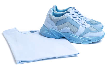 Set of items for sports - Light blue sneakers and t-shirt on a white background.の写真素材