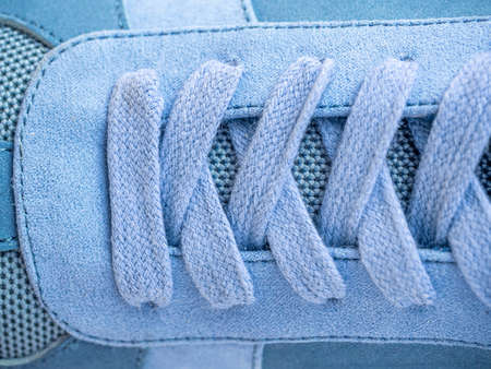 Shoestrings of blue color pattern. Closeup lacing background texture for design. Shoelaces, shoestrings or bootlaces.の写真素材