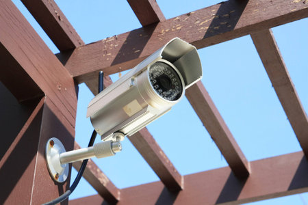 Outdoor Silver CCTV Camera with Blue Skyの写真素材