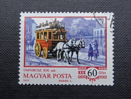 HUNGARY - CIRCA 1970: A stamp printed in HUNGARY shows a horse-drawn omnibus (1870), circa 1977のeditorial素材