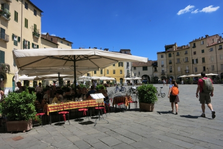 Lucca, Italy - JULY 31 2013  Outside cafe in Piazza Anfiteatro on a hot sunny day のeditorial素材