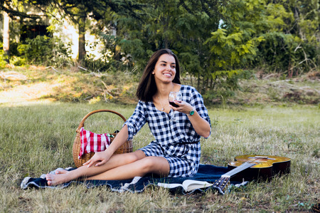 happy woman drinking wine on a vacation dayの写真素材