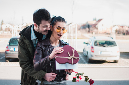 Man gives present to her girlfriend at woman's day.の写真素材