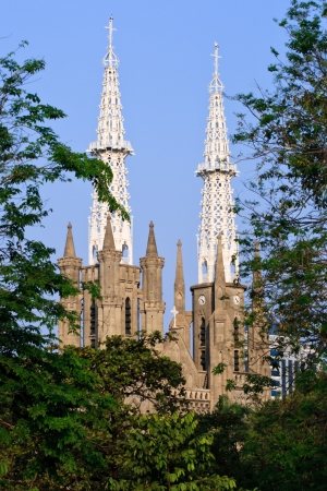 JAKARTA, INDONESIA - SEPTEMBER 5: Neo-gothic Roman Catholic Cathedral - the seat of the Roman Catholic Archbishop of Jakarta - seen through trees on September 5, 2011 in Jakarta.のeditorial素材