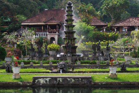 TIRTA GANGGA, INDONESIA - SEPTEMBER 13: Fountain in Tirta Gangga water palace on September 13, 2011 in Tirta Gangga. Place is a maze of pools and fountains in a garden with stone carvings and statues.のeditorial素材