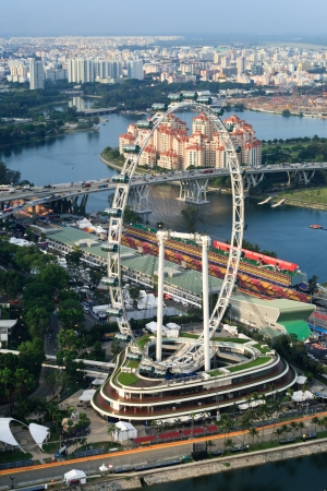SINGAPORE - SEPTEMBER 21: Singapore Flyer during preparations for Formula 1 grand prix, thus featuring part of the track and busy paddock on September 21, 2011 in Singapore.のeditorial素材