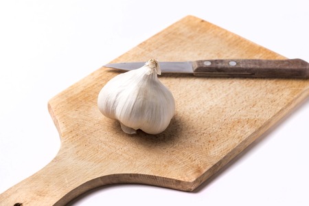 Garlic on wood cutting board - horizontal image