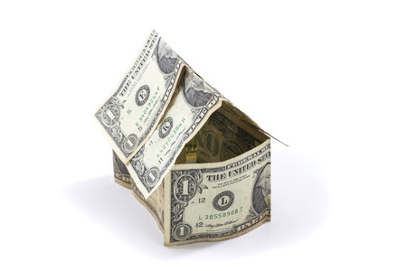 Money house from dollars - isolated on white backgroundの写真素材