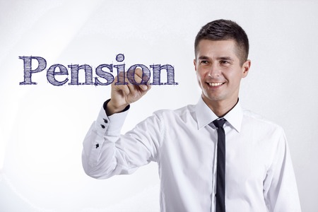 Pension - Young smiling businessman writing on transparent surface - horizontal imagesの写真素材