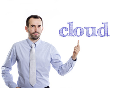 cloud - Young businessman with small beard pointing up in blue shirt - horizontal imageの写真素材