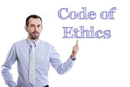Code of Ethics - Young businessman with small beard pointing up in blue shirt - horizontal imageの写真素材