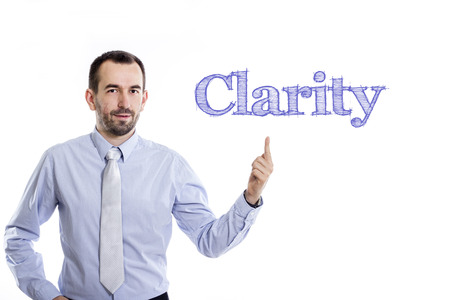 Clarity - Young businessman with small beard pointing up in blue shirt - horizontal imageの写真素材