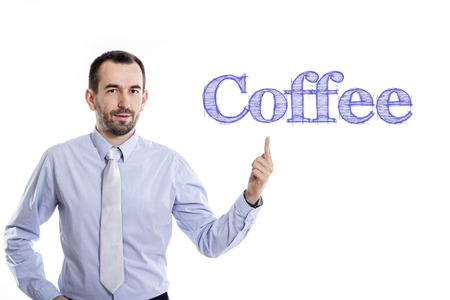Coffee - Young businessman with small beard pointing up in blue shirt - horizontal imageの写真素材