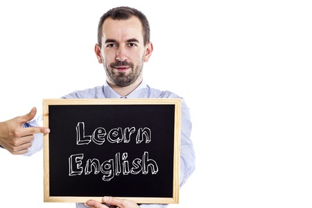 Learn English - Young businessman with blackboard - isolated on white - horizontal imageの写真素材