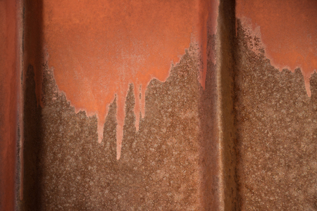 Old painted texture of rusty metal wall with vertical linesの写真素材
