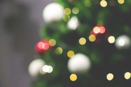 Holiday background with New Year's tree and red, gold, white decorationsの写真素材