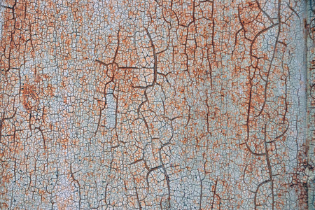 Old painted texture of rusty metal wall with cooper cracks