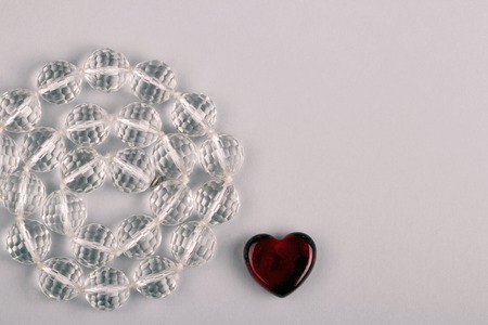 Beautiful symbol of Valentines day - red heart and crystal beadsの写真素材