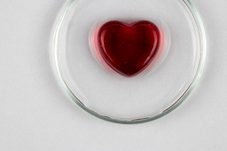 Abstract red heart as a symbol of Valentine day on white backgroundの写真素材