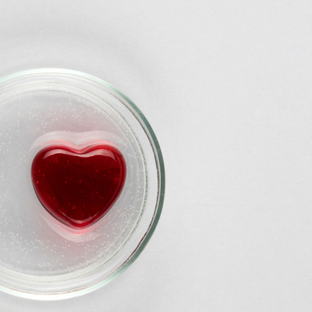 Abstract red heart as a symbol of Valentine day on white backgroundの写真素材