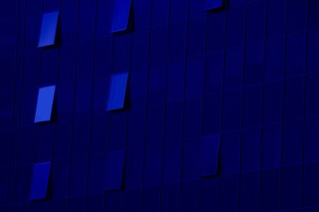 The wall of skyskraper business-center eith opened windows. Classic blue - trend color of 2020の写真素材