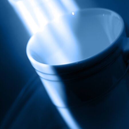 White single cup with asymmetry of bright light in trend color of 2020 - Classic Blueの写真素材