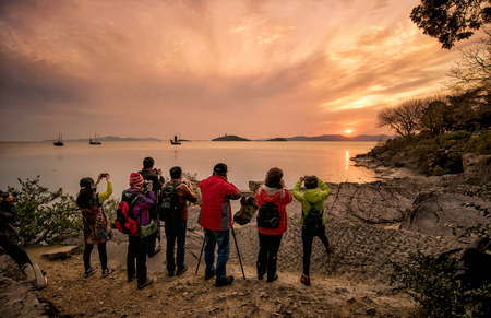 Photographers taking Taihu sunset at the Turtle Head Islet Park.のeditorial素材