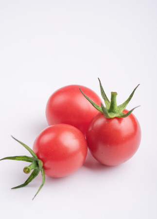 Three fresh Cherry tomatoesの写真素材