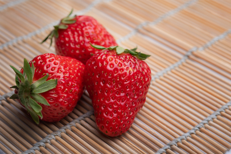 Strawberries on bamboo matsの写真素材