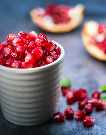 Fresh pomegranates, blood red pomegranate seeds.の写真素材