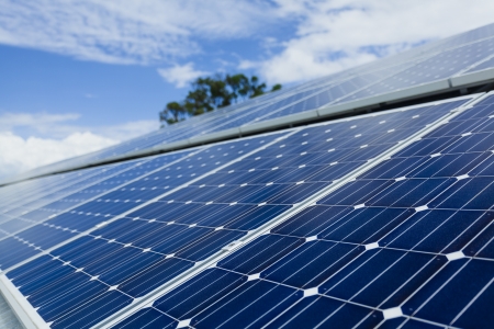 Solar panels on factory roof の写真素材