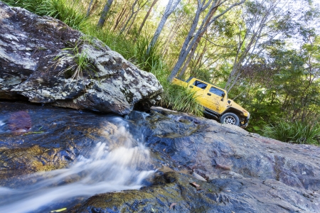 4x4 truck on top a waterfall