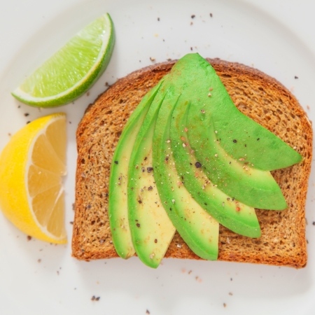 Avocado on rye bread with lemon