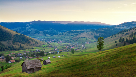 View of traditional Transylvanian valley at sunset, Romaniaの写真素材
