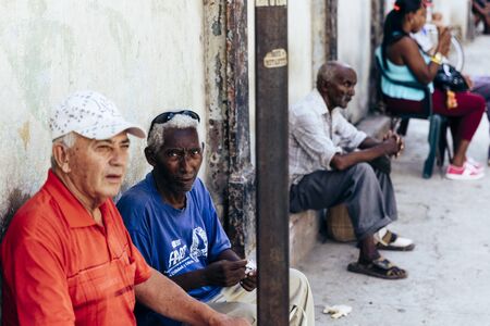 HAVANA, CUBA- October, 2018: Havana people sitting in the afternoon shadow on a hot day.のeditorial素材
