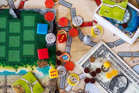 Board games, coins, bills, dice and cards