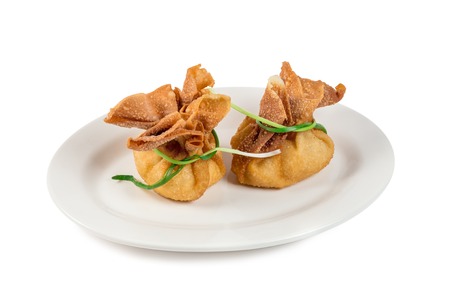 the beef meat with broth baked in dough pouches on oval plate isolated white background beautifully elegant gourmet food recipe idea still life.の写真素材