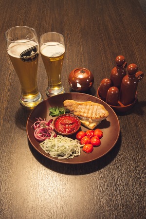NOVODVINSK, RUSSIA - NOVEMBER 21TH, 2014. Pint of beer on bar in a pub.のeditorial素材