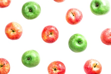 Flat composition of red and green apples isolated on white background.