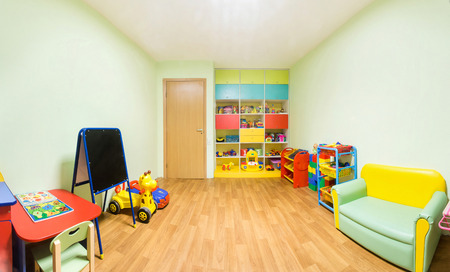 Kindergarten nursery game room light green interior.の写真素材