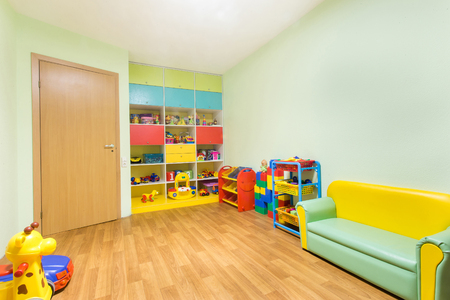 Kindergarten nursery game room light green interior.の写真素材
