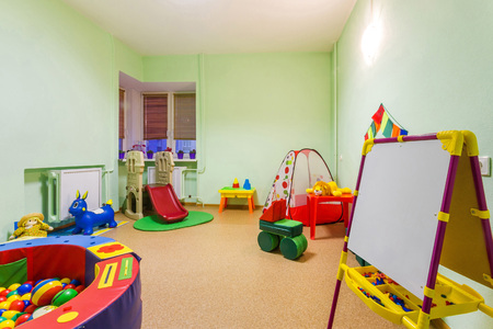 Interior Small Pastel Toned Green Game Room in Kindergarten.の写真素材
