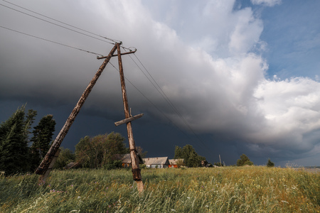 Severe thunderstorm moving in. 5 minutes before squall. Danger of stay near the power lineの写真素材