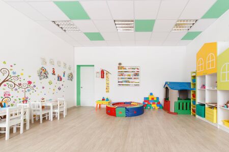 Arkhangelsk, Russia - march 3, 2018: Bright Interior of a modern kindergarten in yellow and green colors. Natural day lightのeditorial素材